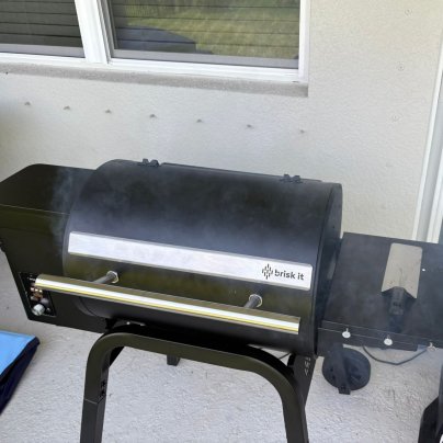 The Brisk It Zelos-450 AI Pellet Smoker on a patio before testing