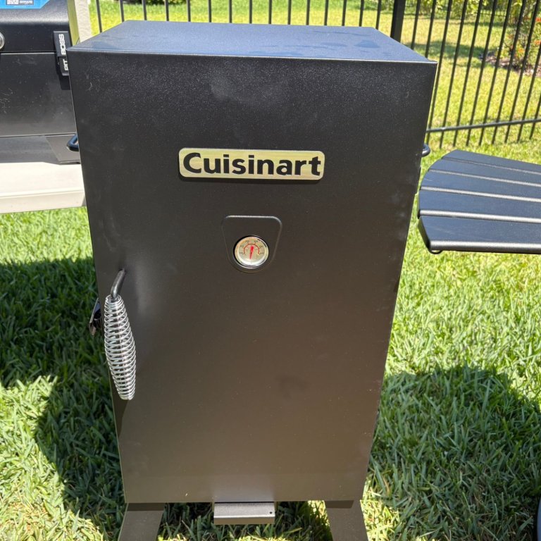 The Cuisinart Vertical Electric Smoker on a lawn before testing