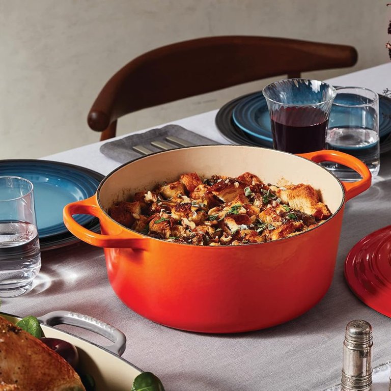 A cooked dish in the Le Creuset Enameled Cast Iron Dutch Oven and on the table for serving