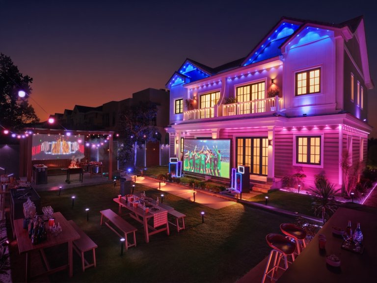 A home lit up with Govee outdoor lights for a night get together.