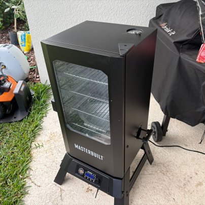 The Masterbuilt 710 WiFi Digital Electric Smoker on a patio before testing