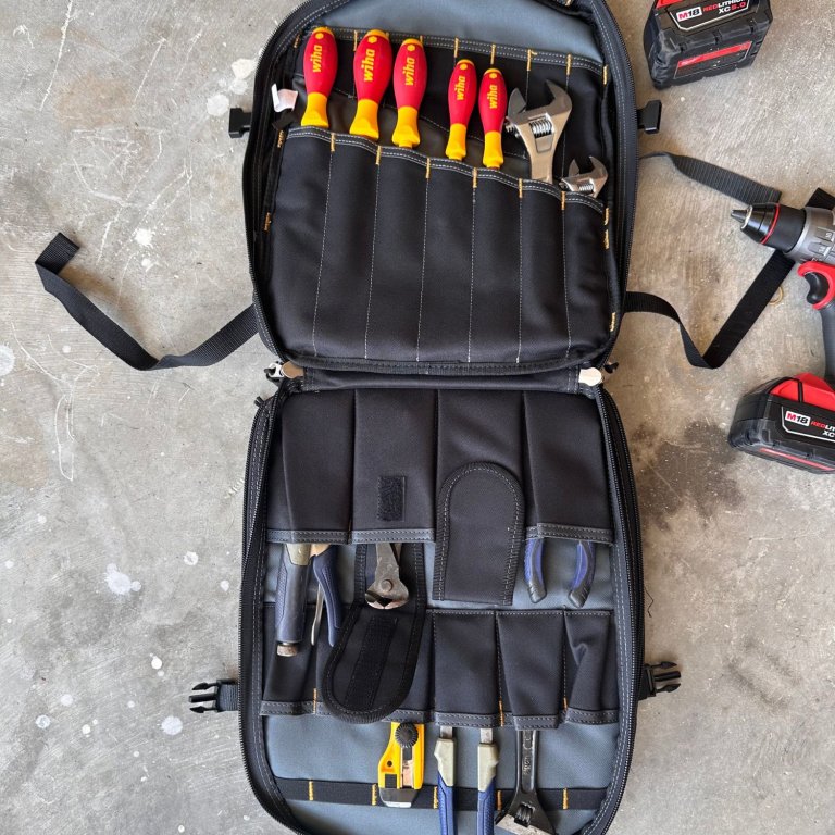 The Milwaukee Ultimate Jobsite Tool Backpack open to show it full of tools during testing