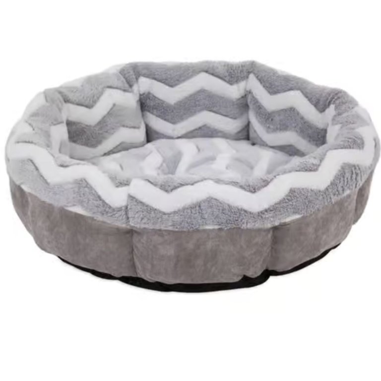 A gray and white circular dog bed on a white background