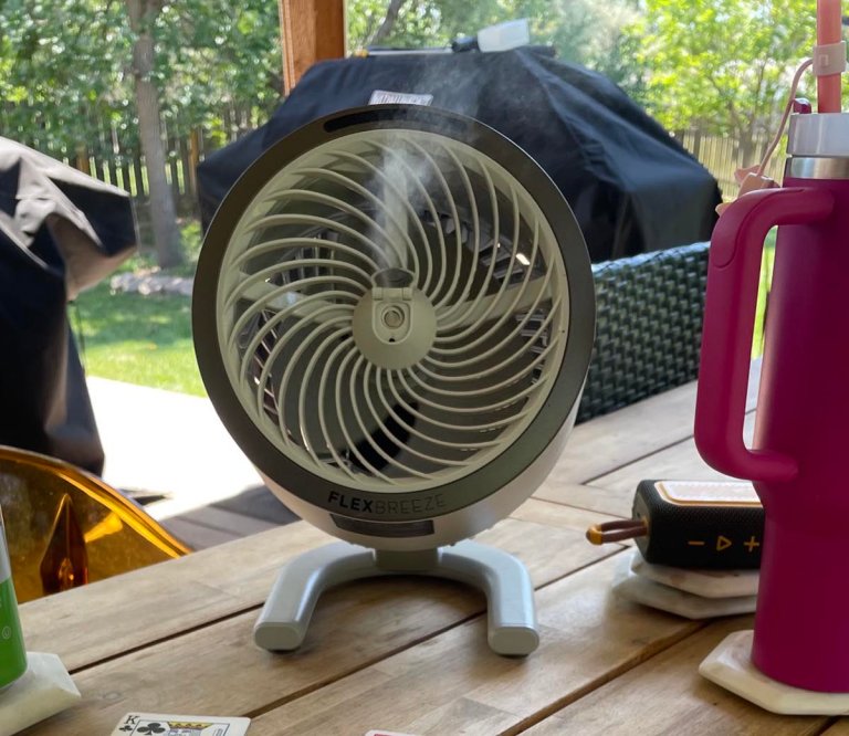 Shark FlexBreeze HydroGo Pro Fan next to cards and a speaker