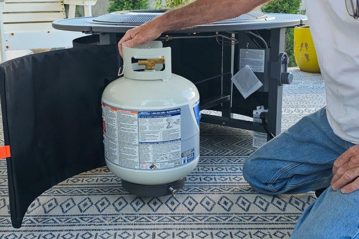 Side door opens for inserting propane tank