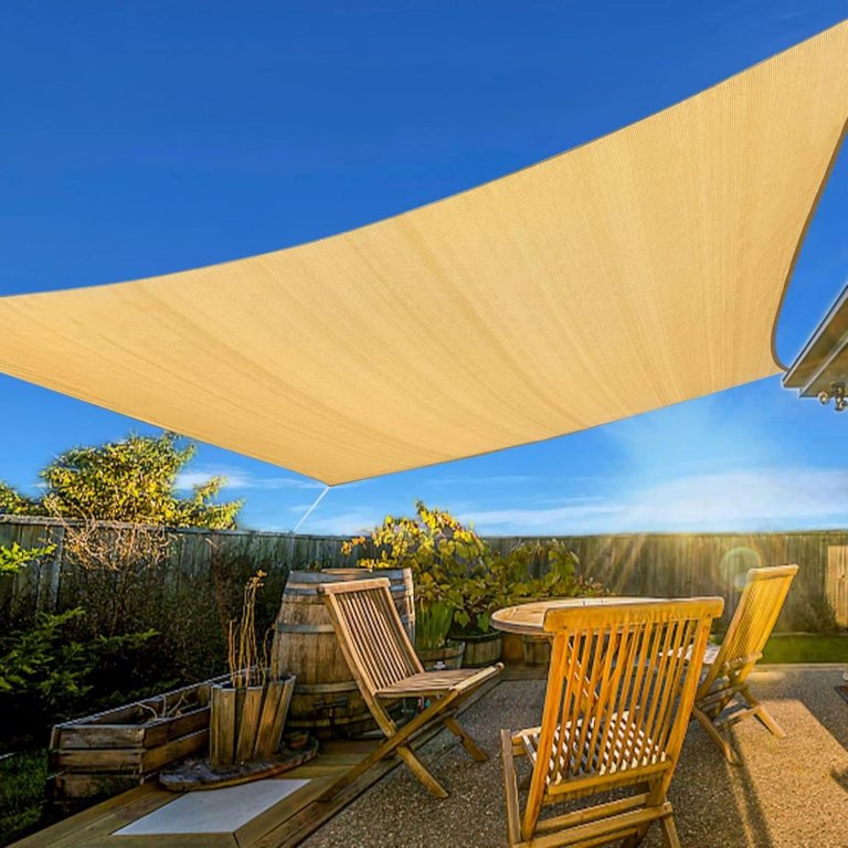 The Artpunch sail shade installed over an outdoor seating area