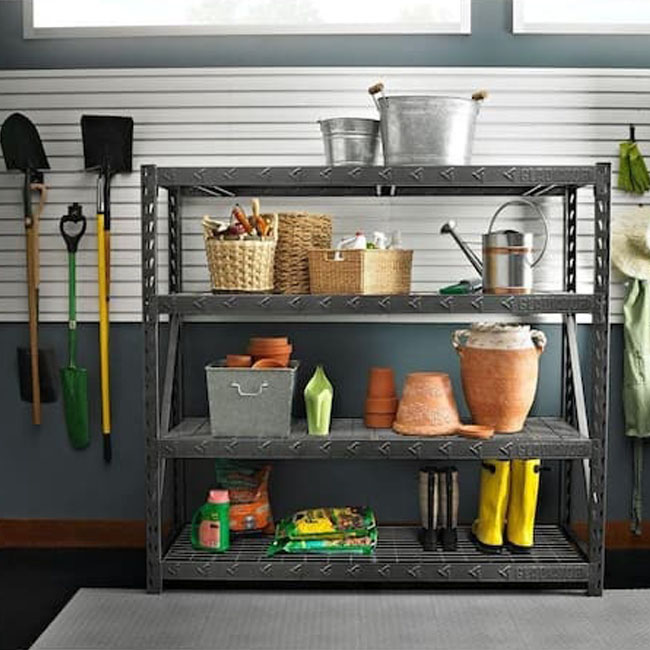 The Gladiator 4-tier freestanding shelving unit in a garage and filled with gear