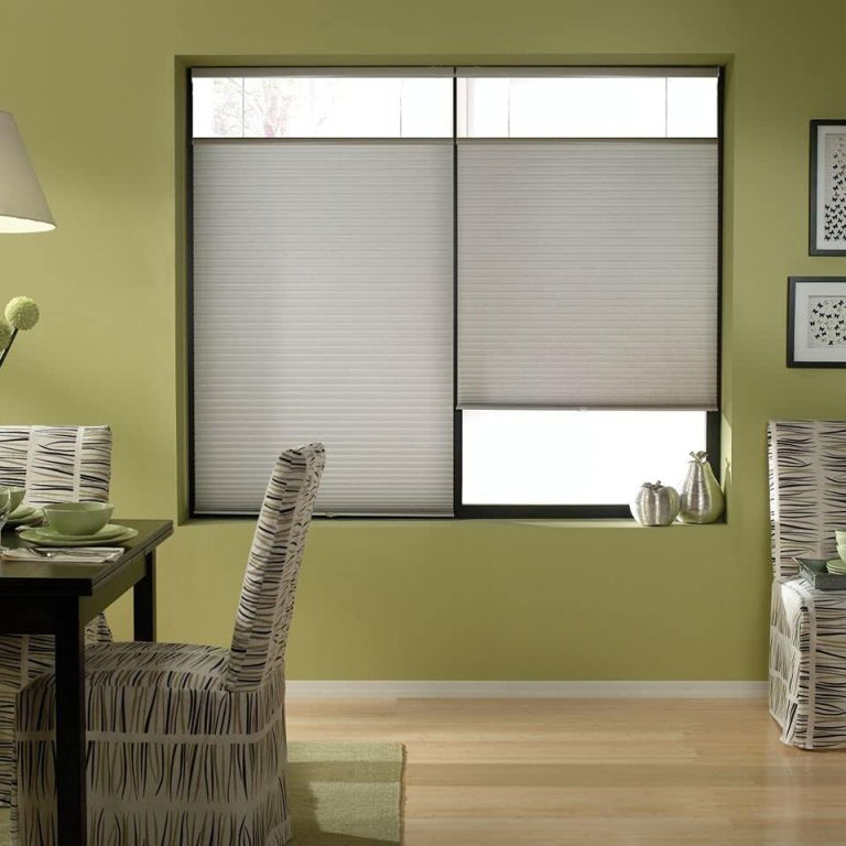 The Windowsandgarden cordless cellular shades installed on a window in a dining room
