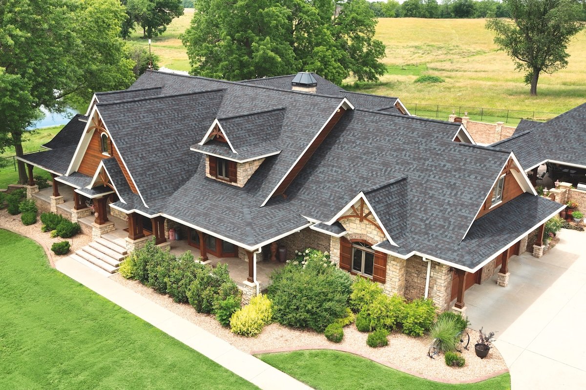 A large Arts & Crafts style home featuring a roof with TAMKO HailGuard shingles for storm durability.