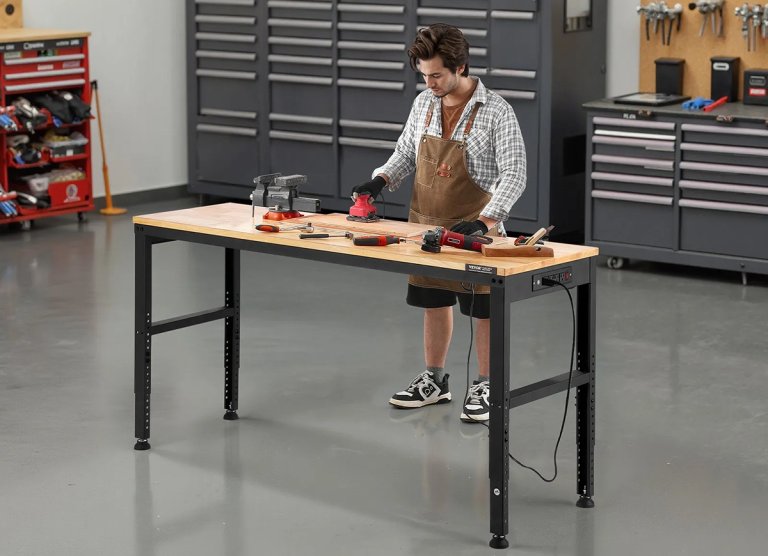 A DIYer working on a VEVOR workbench in a garage workshop.