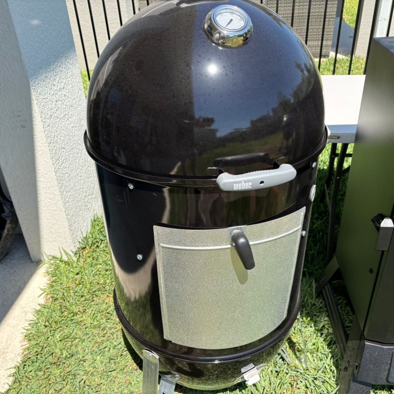 The Weber Smokey Mountain Cooker in a yard before testing