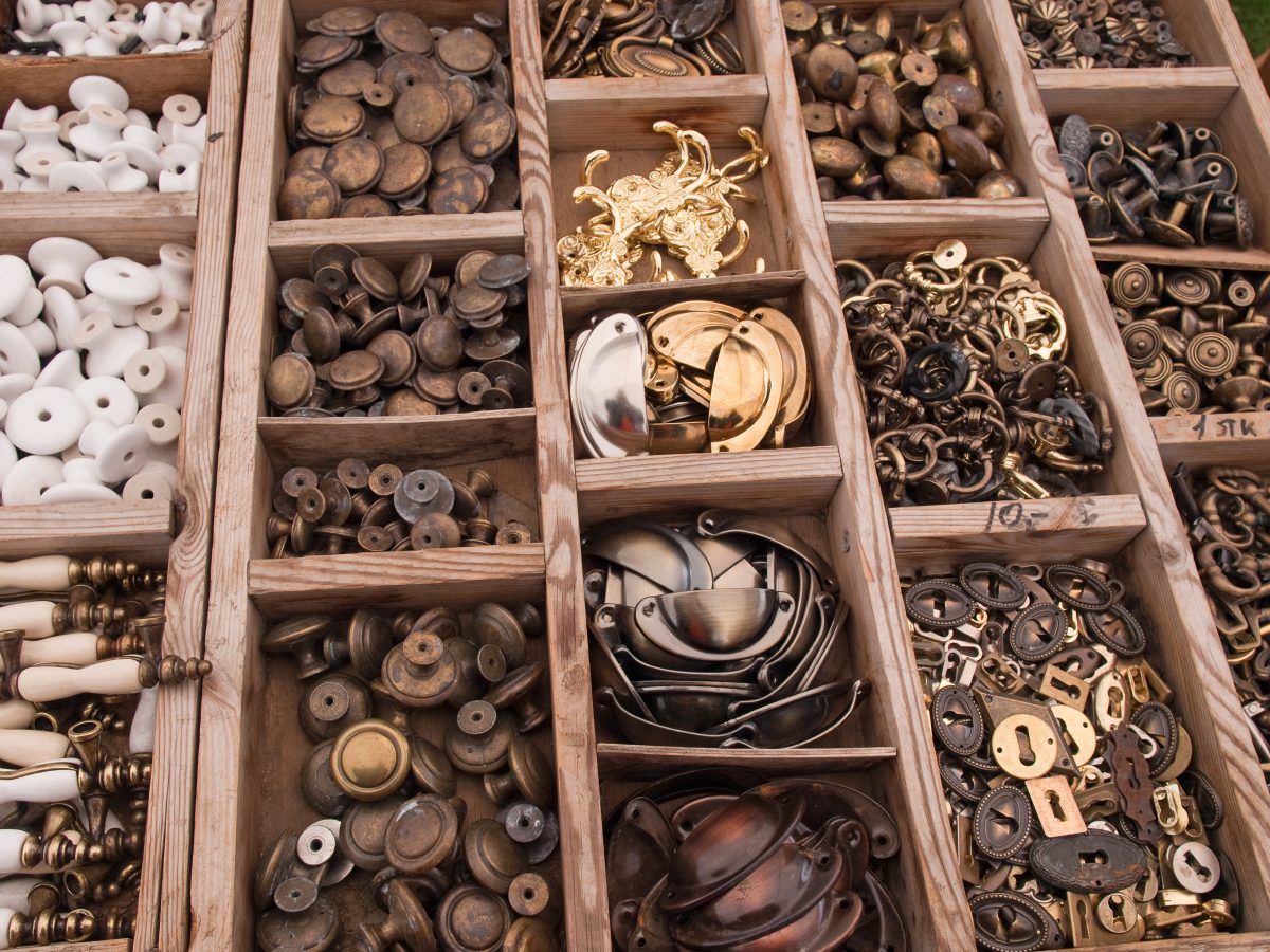 Bins filled with antique cabinet hardware