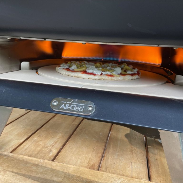 A pizza cooking in the All-Clad pizza oven during testing