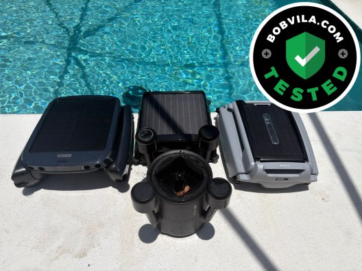 A group of the best robotic pool skimmers together on a pool deck before testing