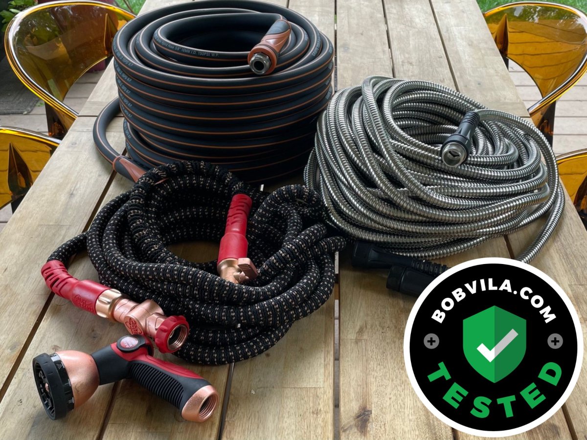 Three of the best lightweight garden hoses on a patio table before testing