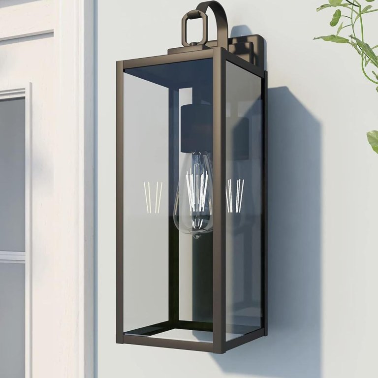 A Pia Ricco Yorand Outdoor Wall Lantern Light installed next to a front door to enhance curb appeal