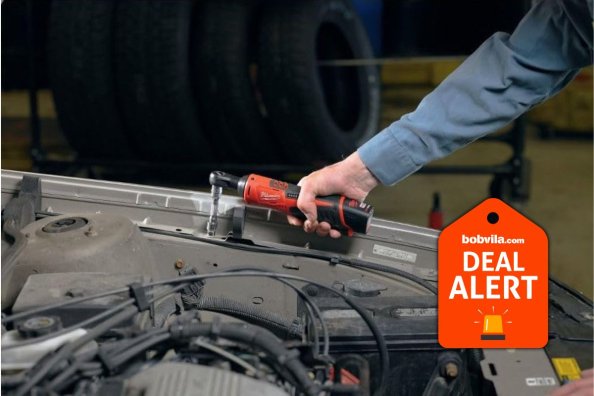 Milwaukee's M12 12V Lithium-Ion Cordless 3/8 in. Ratchet in use in a garage workshop, now free with qualifying purchase at Home Depot