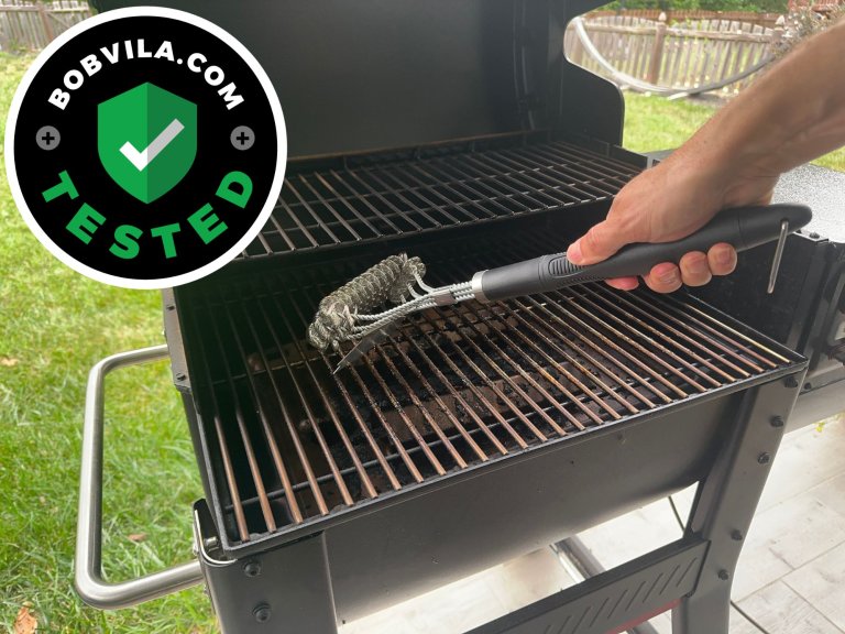 A product tester using the GrillArt Bristle-Free 17-Inch Brush and Scraper to clean their grill