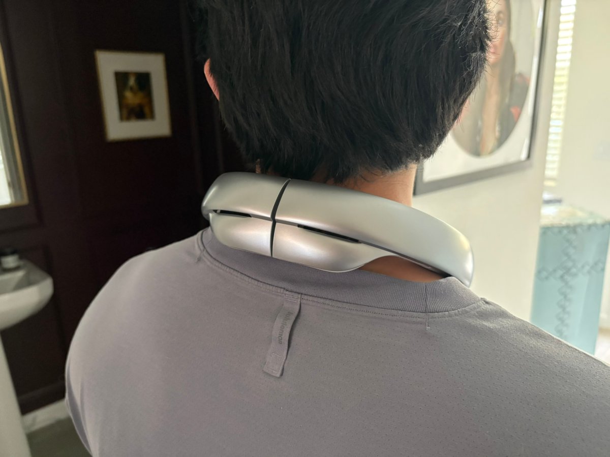 a person wearing neck fans model JisuLife Neck Fan Pro at home