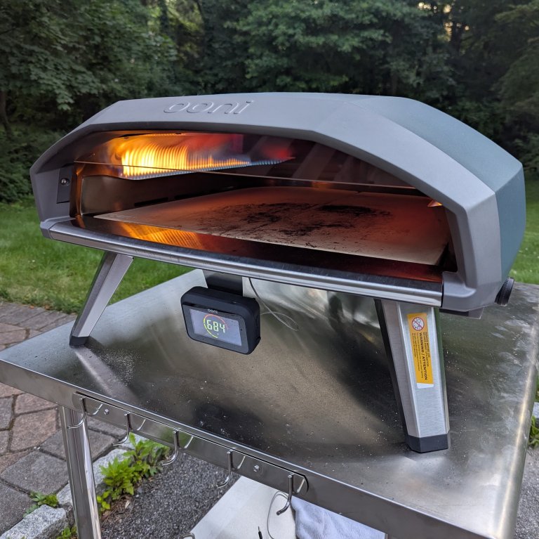 Ooni Koda 2 Pro heating up before baking a pizza in the backyard