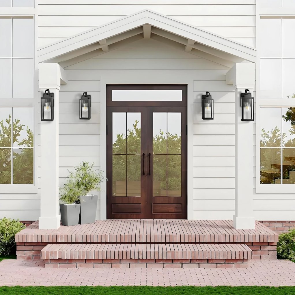 A front door flanked by four Pia Ricco Yorand Outdoor Lanterns, which are a gorgeous way to update your home's curb appeal