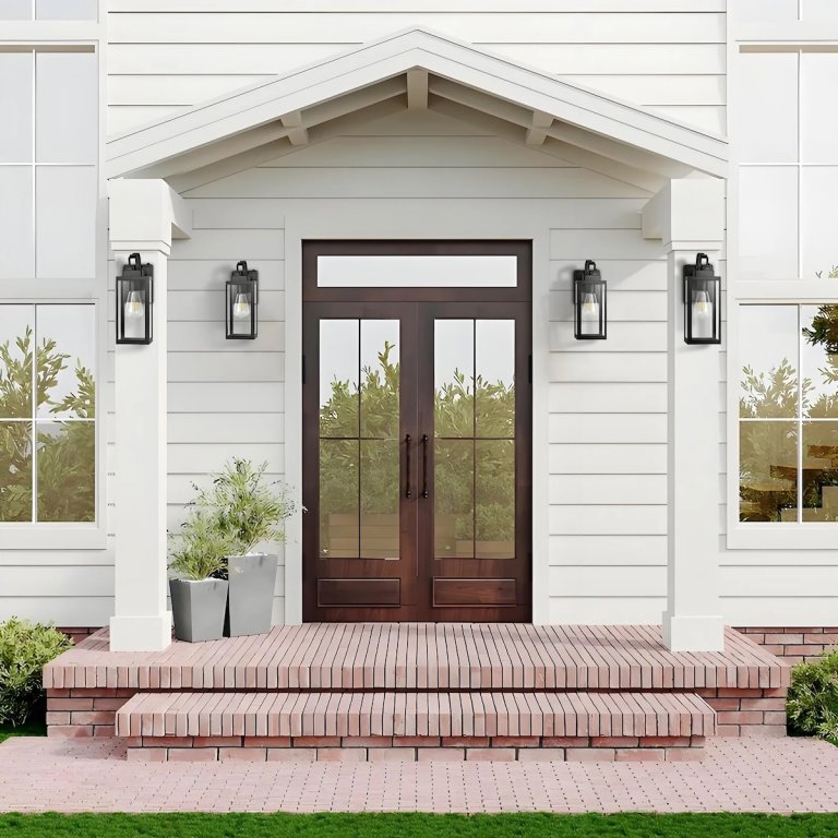 A front door flanked by four Pia Ricco Yorand Outdoor Lanterns, which are a gorgeous way to update your home's curb appeal