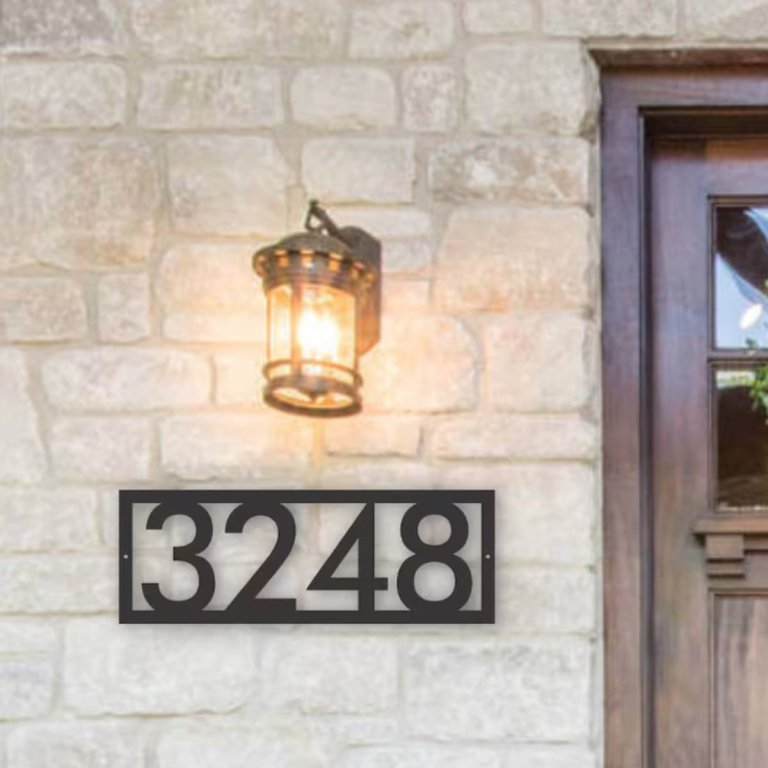 Pinky Design Custom Metal House Number Sign installed next to a front door to enhance curb appeal