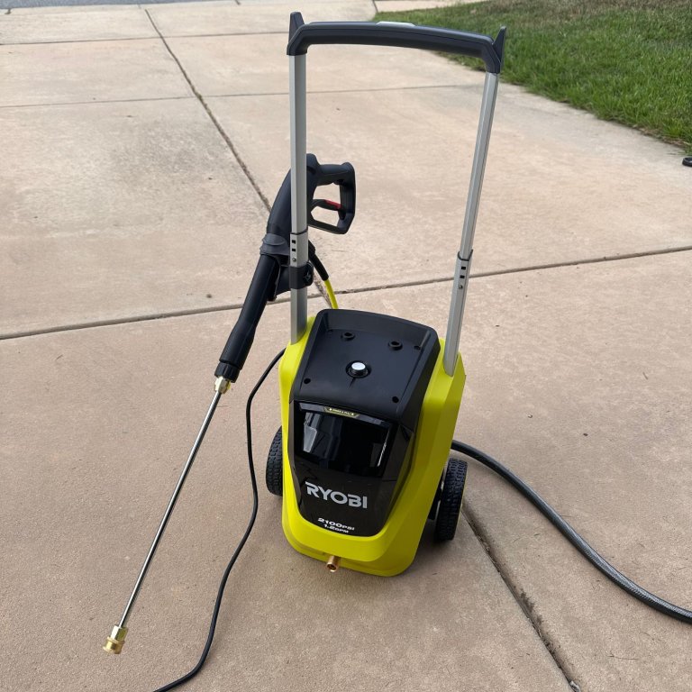 The Ryobi RY142012 Pressure Washer on a driveway during testing