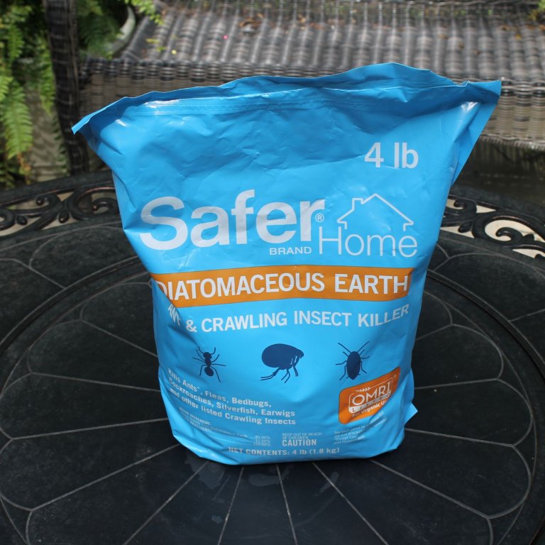 A bag of Safer Brand Diatomaceous Earth on a table before testing