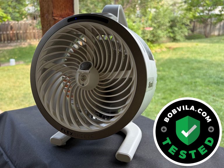 The Shark FlexBreeze HydroGo Pro outdoor misting fan sitting on top of a covered grill during testing