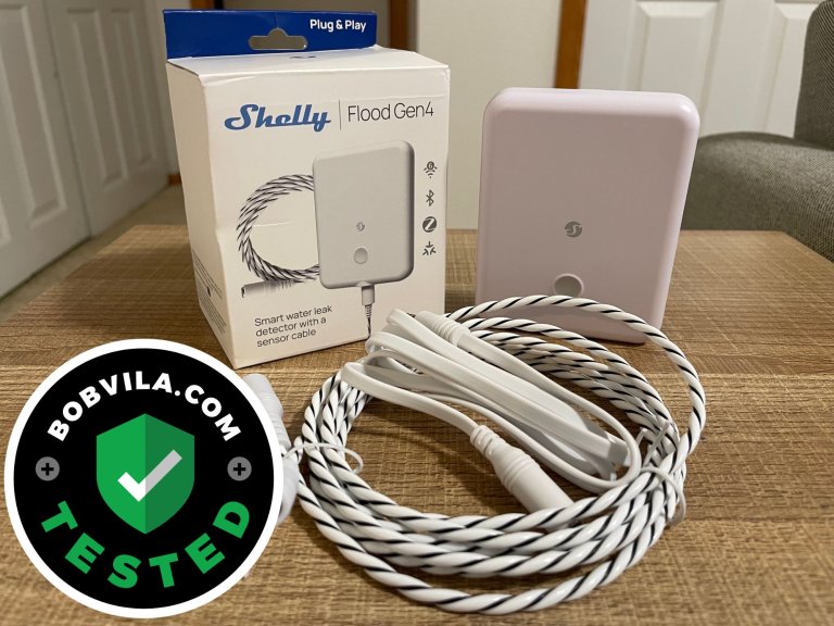 The Shelly Flood Gen4 Smart Water Leak Detector on a table before installation and testing