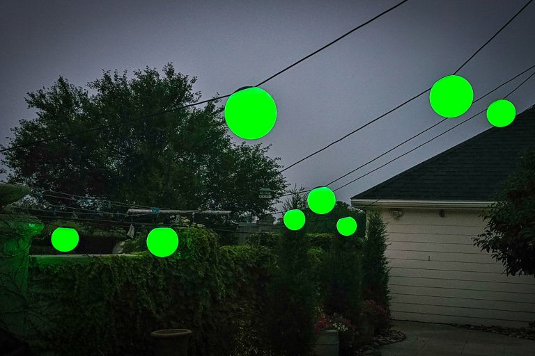 Enbrighten solid green sphere lights glowing at night during testing