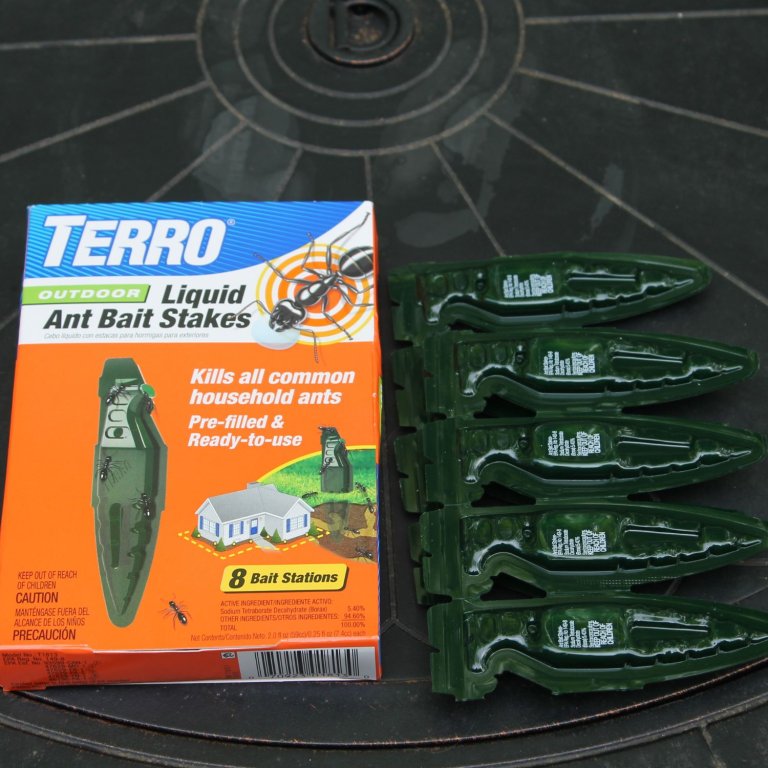 Several Terro Ant Killer Liquid Ant Baits next to their packaging on a table