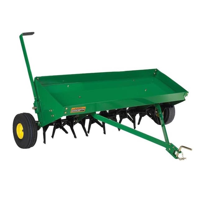 The John Deere 48 Tow-Behind Plug Aerator on a white background