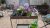 The Vego Garden potting cart full of blooming plants in pots on a pea gravel patio