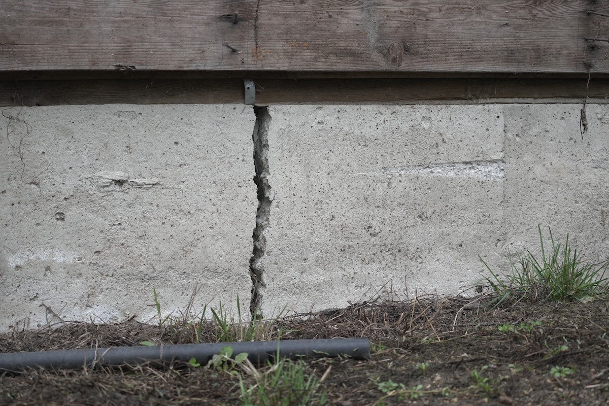 Close-up of a deep house foundation crack.