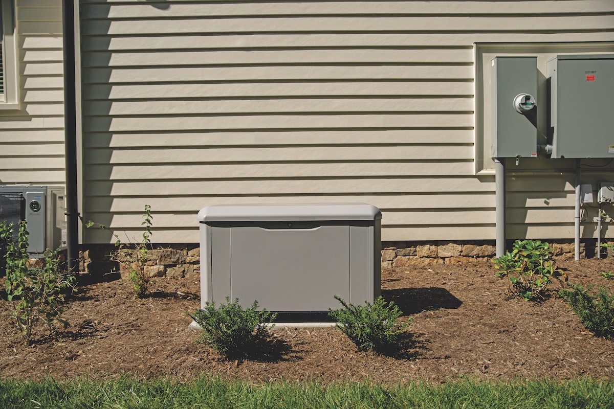 A propane-powered generator installed outside of a residential new construction home.