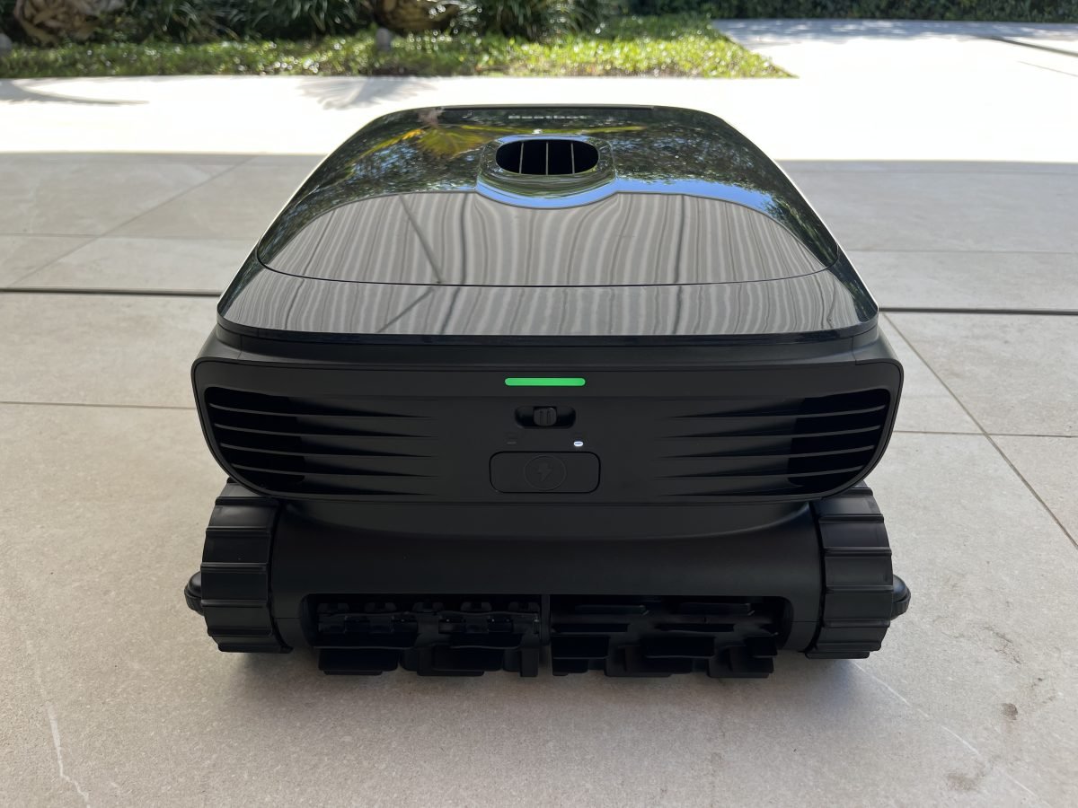 Close up of Beatbot Sora 70 robotic pool cleaner sitting next to a pool