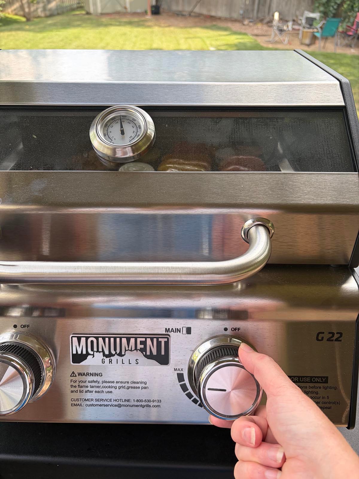 Adjusting one burner on the Monument Grills G22 Stainless Tabletop Propane Grill