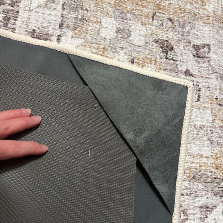 Attaching the Gabrielle Washable Rug to the cushioned modular rug pad