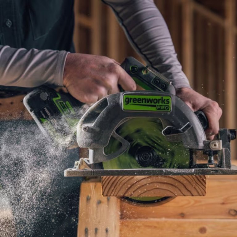A person using the Greenworks PowerAll Pro 24V 7 ¼-inch 6,000 RPM Circular Saw at a construction site