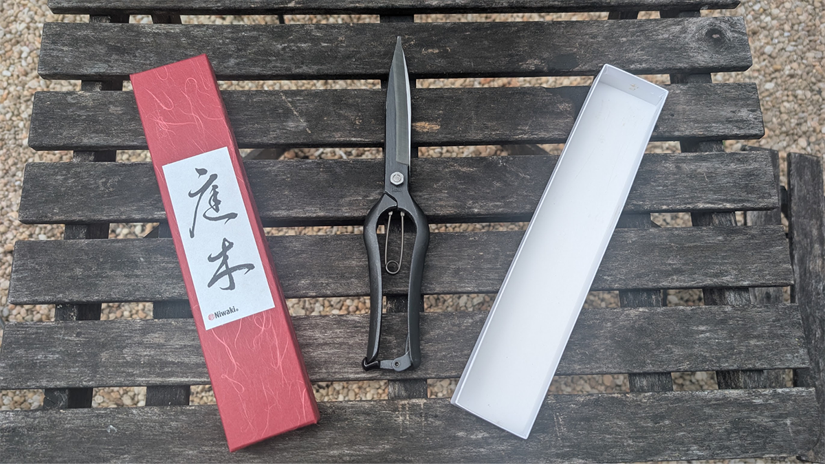The Niwaki Sentei Topiary Clippers with their packaging on a table before testing