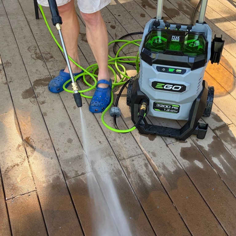 Using the Ego Power+ HPW3204-2 Pressure Washer to clean grease spots off a deck