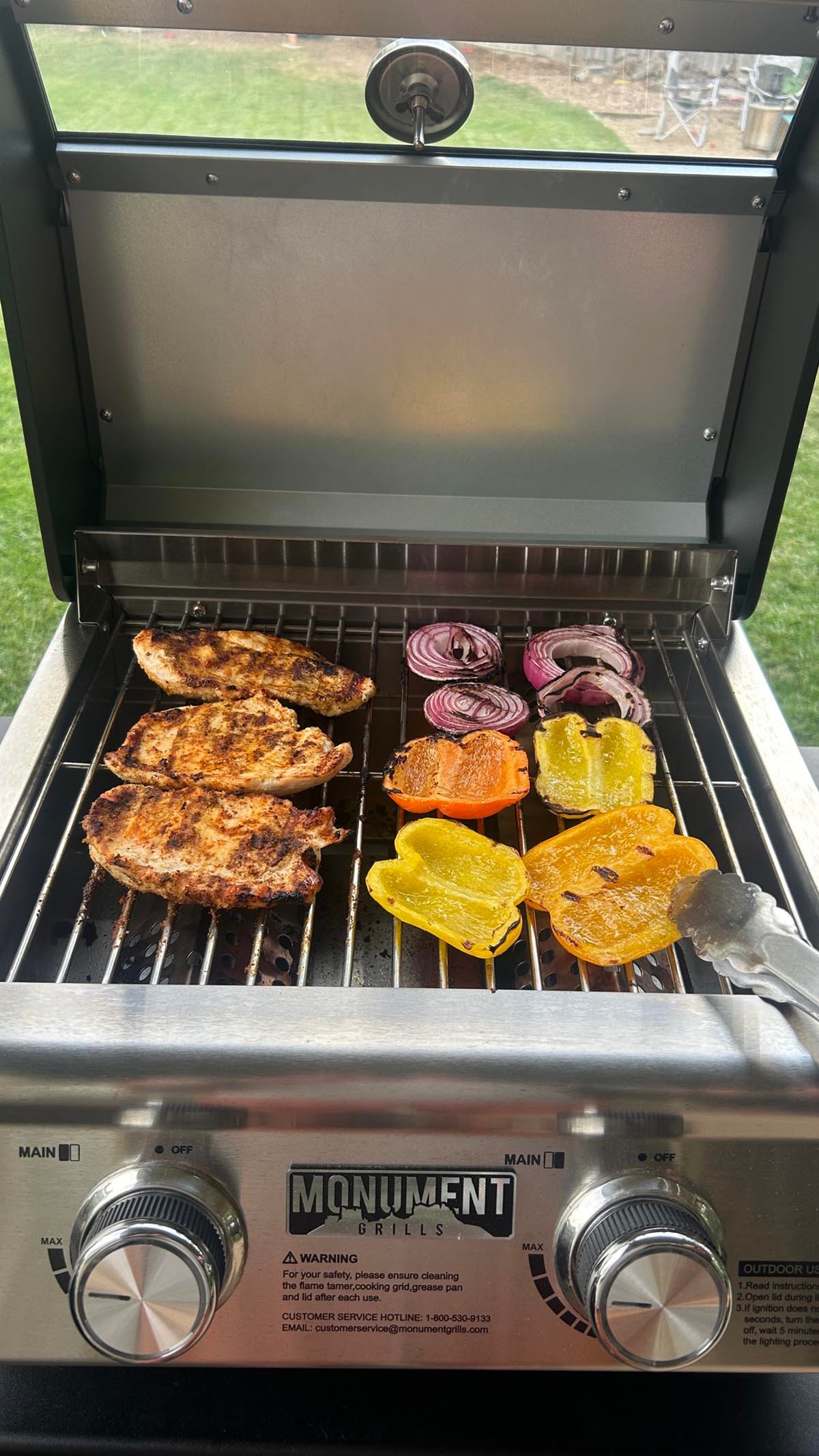 Using the Monument Grills G22 Stainless Tabletop Propane Grill to cook chicken and veggies