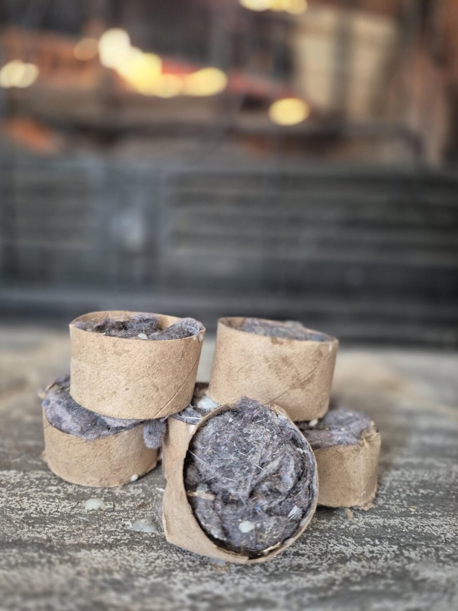 Dryer lint fire starters near a fireplace.