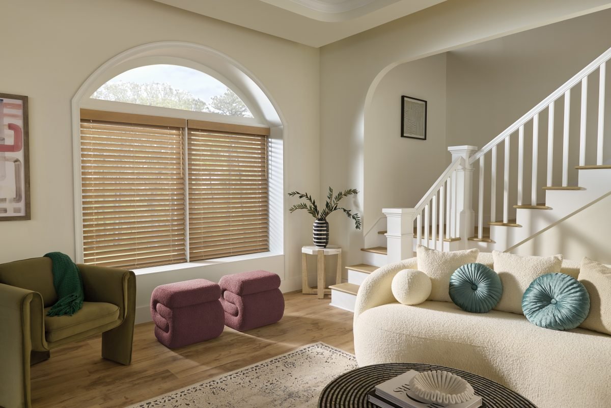 Modern living room with closed wood blinds.