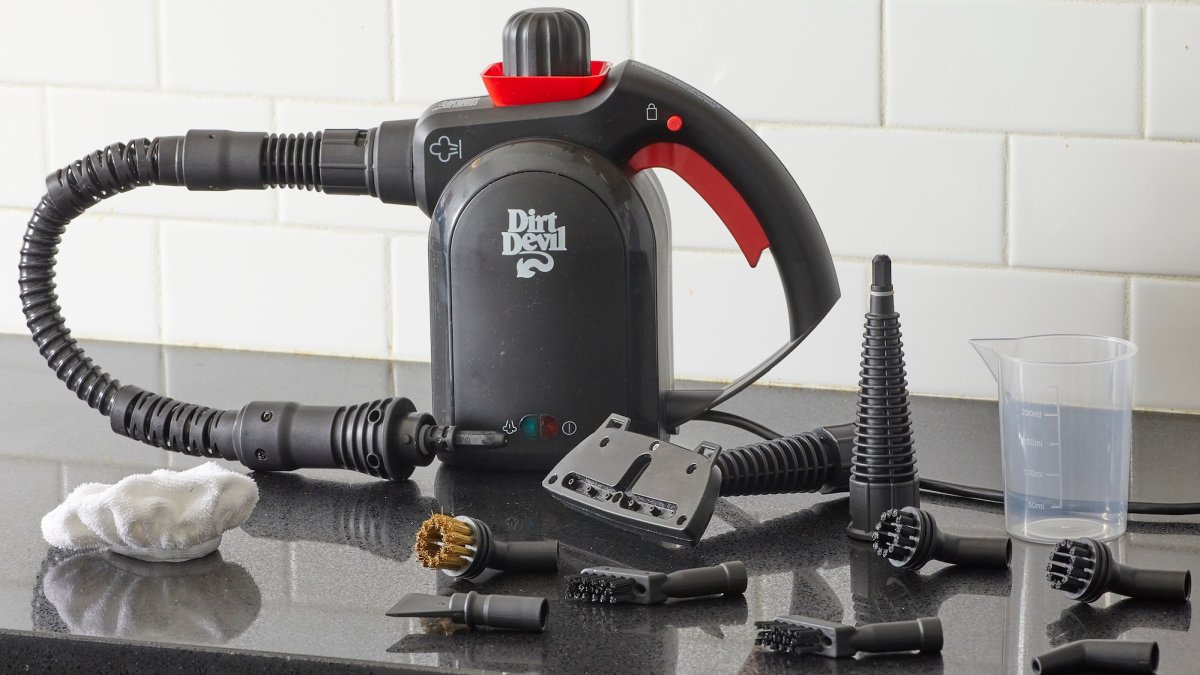 Dirt Devil steam cleaner on a kitchen countertop surrounded by its various attachments.