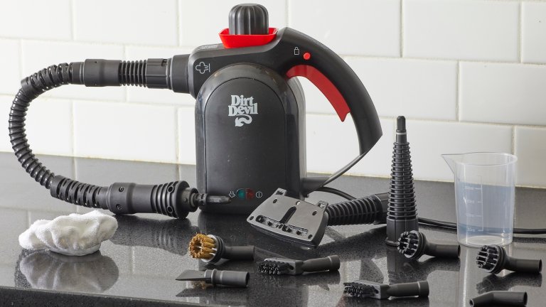 Dirt Devil steam cleaner on a kitchen countertop surrounded by its various attachments.