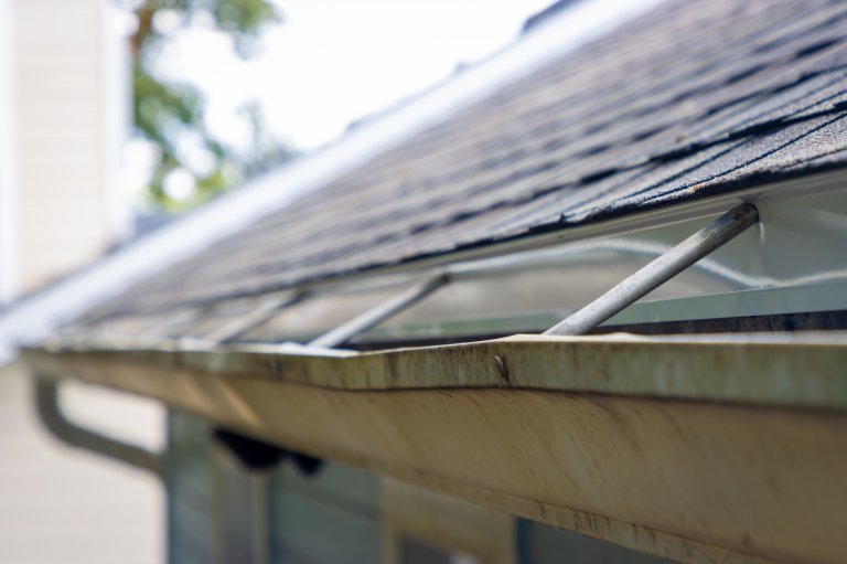An old worn gutter on a residential home.