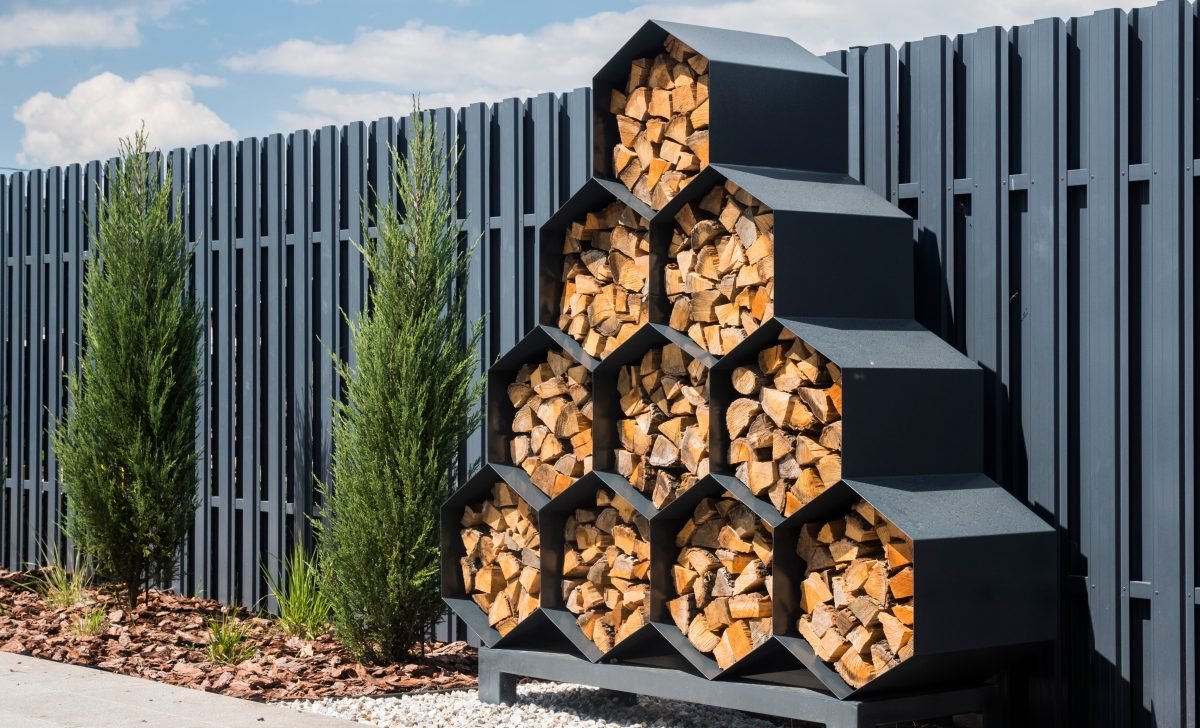 Stylish decorative firewood rack with cells in the form of honeycombs